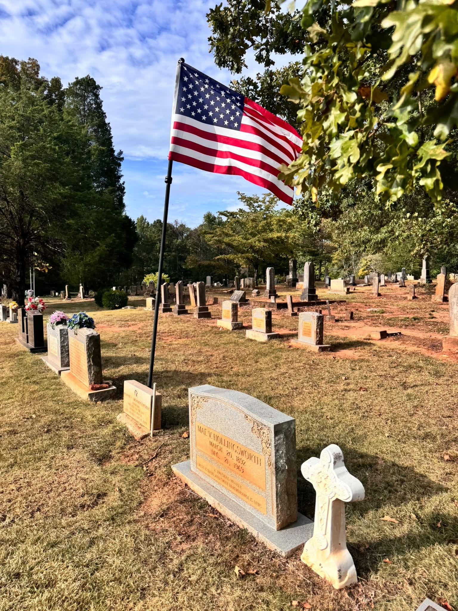 Headstones and an American flag at Genery’s Gap Cemetery
